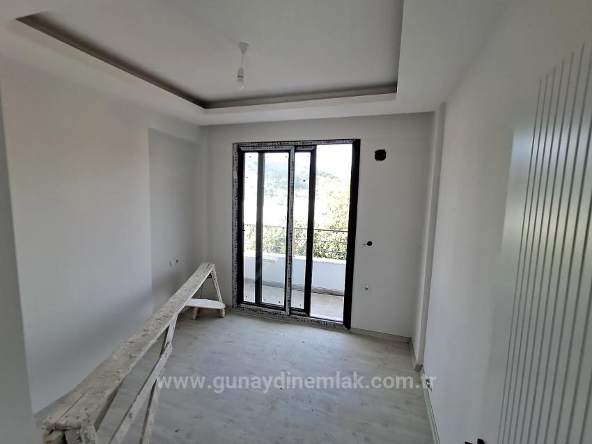 Brandneue 2+1 Wohnung Zum Verkauf In Ortaca Karaburun Mit Geschlossener Küche