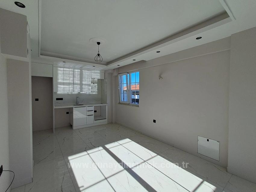 1+1-Apartment Mit Swimmingpool Und Fußbodenheizung In Ortaca Cumhuriyet Zu Verkaufen