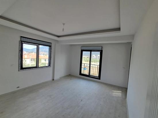 Brandneue 2+1 Wohnung Zum Verkauf In Ortaca Karaburun Mit Geschlossener Küche