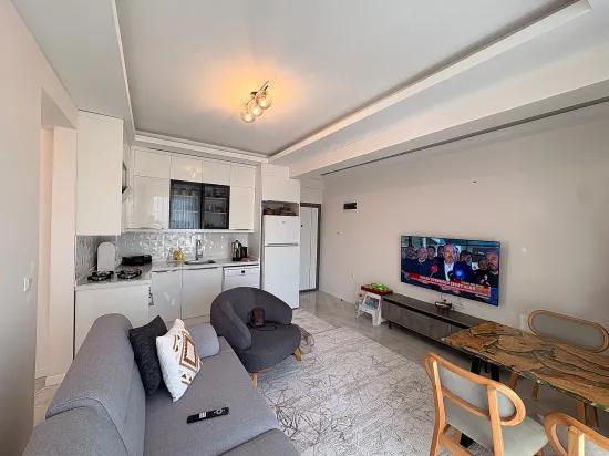 In Ortaca Çaylı mit Pool 2+1 zu verkaufen Wohnung, Eigentumswohnung, Zwischengeschoss