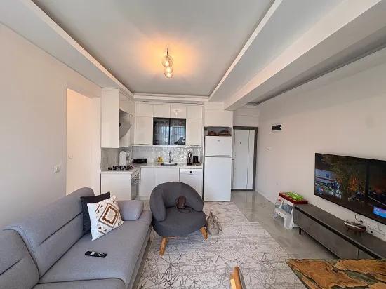 In Ortaca Çaylı mit Pool 2+1 zu verkaufen Wohnung, Eigentumswohnung, Zwischengeschoss