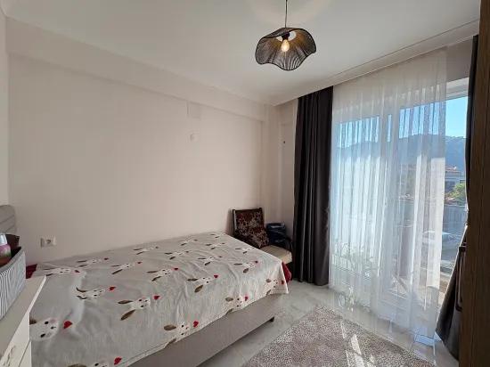 In Ortaca Çaylı mit Pool 2+1 zu verkaufen Wohnung, Eigentumswohnung, Zwischengeschoss