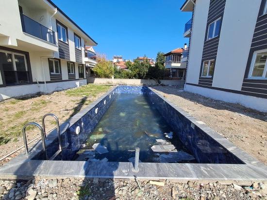 Günaydın Real Estate Bietet Eine 2+1-Wohnung Mit Pool Im Viertel Atatürk Zum Verkauf An.
