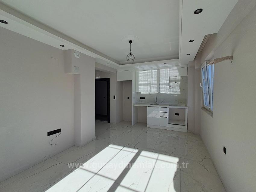 1+1 Apartment With Swimming Pool And Underfloor Heating For Sale In Ortaca Cumhuriyet