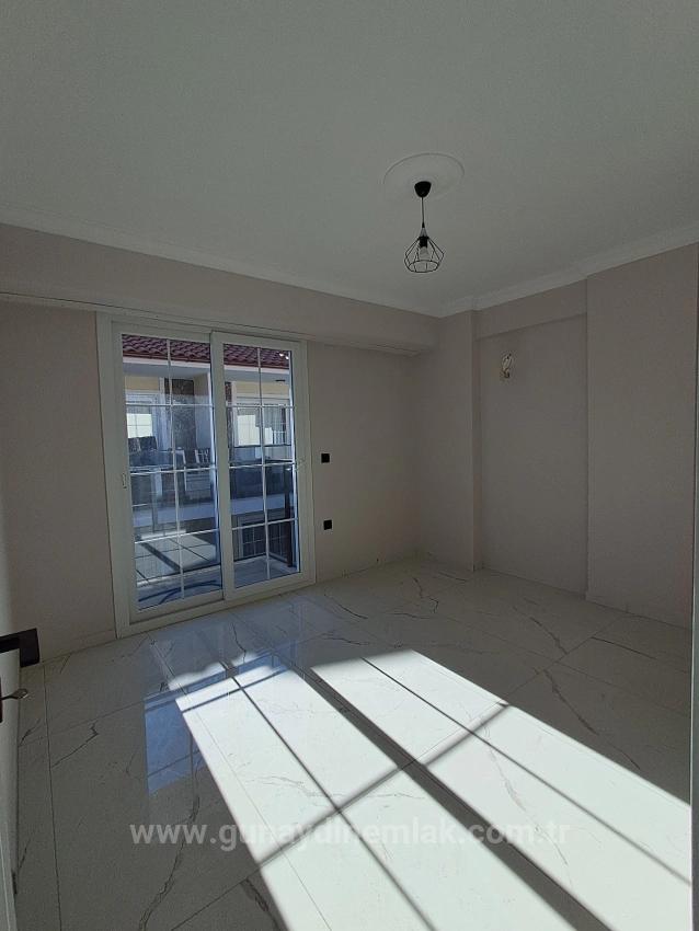 1+1 Apartment With Swimming Pool And Underfloor Heating For Sale In Ortaca Cumhuriyet