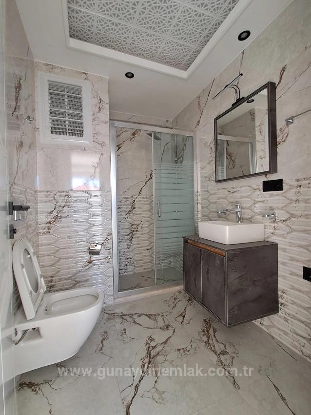 1+1 Apartment With Swimming Pool And Underfloor Heating For Sale In Ortaca Cumhuriyet