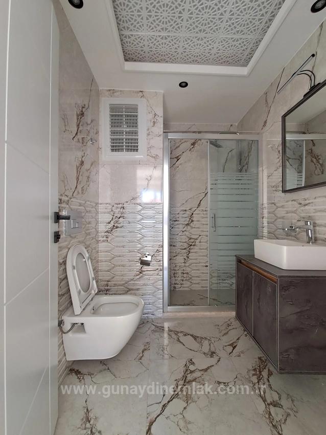 1+1 Apartment With Swimming Pool And Underfloor Heating For Sale In Ortaca Cumhuriyet