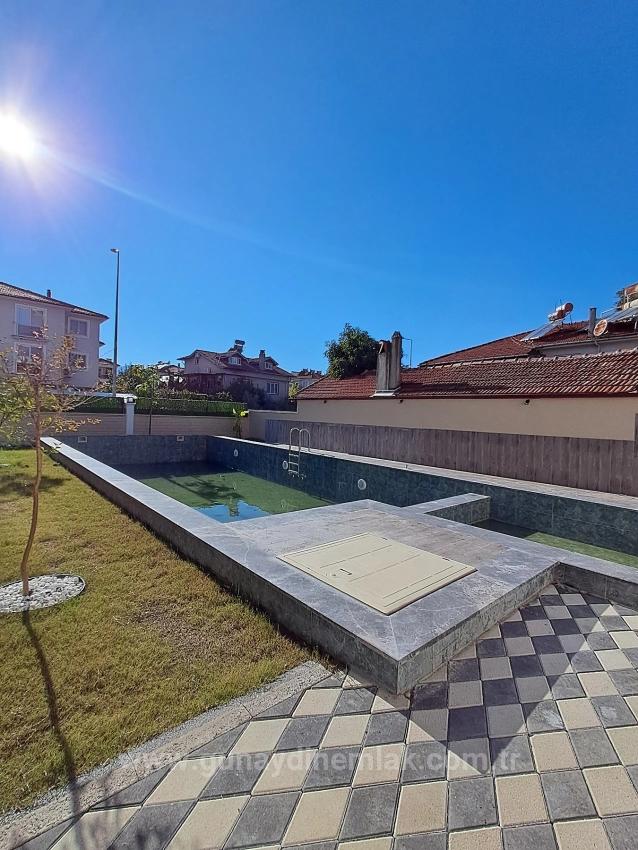 1+1 Apartment With Swimming Pool And Underfloor Heating For Sale In Ortaca Cumhuriyet