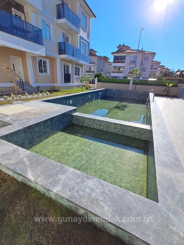 1+1 Apartment With Swimming Pool And Underfloor Heating For Sale In Ortaca Cumhuriyet