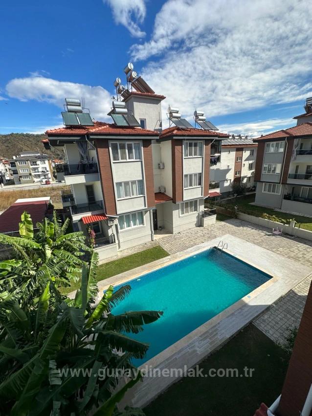 2+1 Apartment With En-Suite Bathroom And Pool For Sale In Ortaca Bahçelievler Neighborhood.