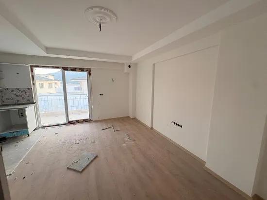 Spacious 1+1 Apartment For Sale In Ortaca Karaburun Neighborhood.