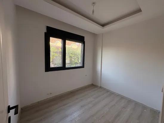 Spacious 2+1 Apartment For Sale In Ortaca Karaburun Neighborhood.