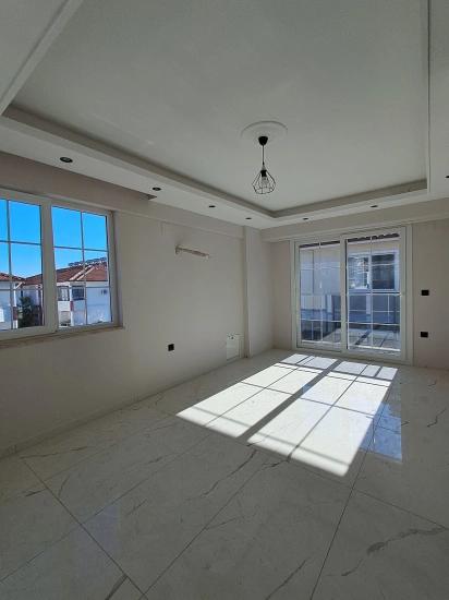 1+1 Apartment With Swimming Pool And Underfloor Heating For Sale In Ortaca Cumhuriyet