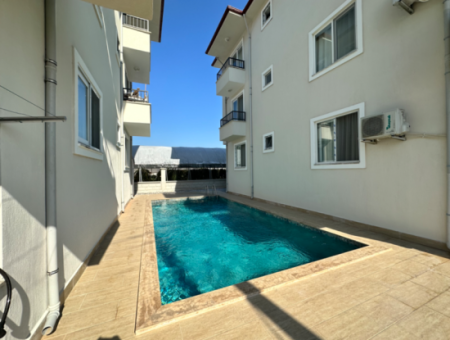 130 M2 3 1 Furnished Apartment For Sale With Pool In Ortaca Karaburun, Mugla.