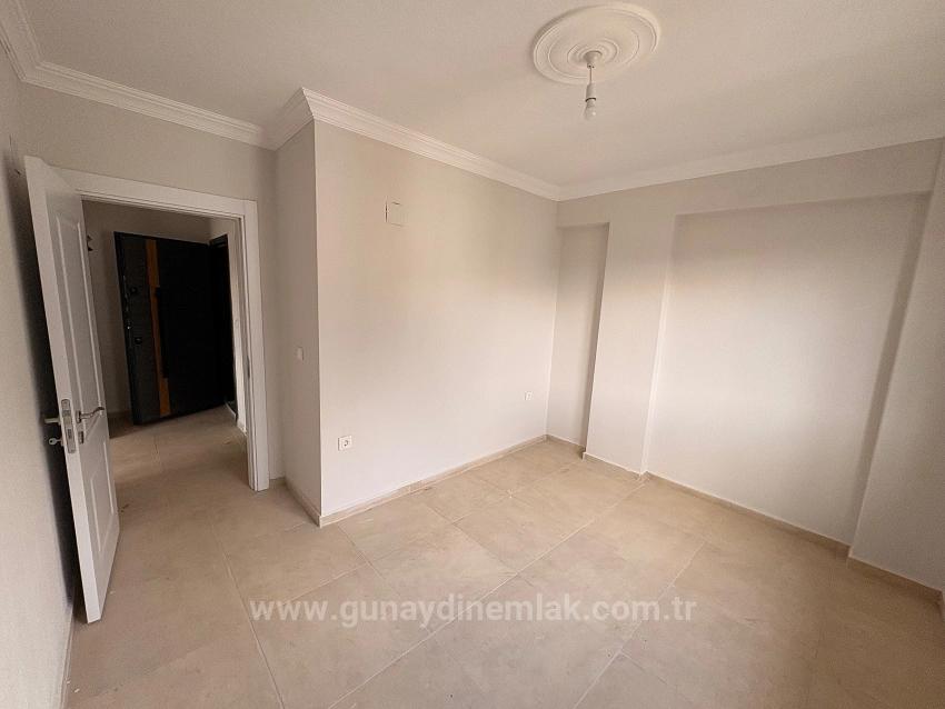 Продается Новая Квартира (1+1) В Закрытом Жилом Комплексе С Бассейном В Районе Карабурун, Ортаджа, Мугла.