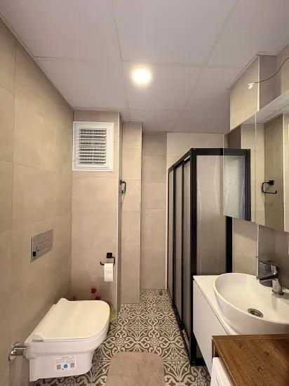 в Ortaca Çaylı с бассейном 2+1 на продажу квартира, Этаж собственность, промежуточный этаж