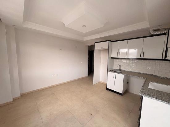 Продается Новая Квартира (1+1) В Закрытом Жилом Комплексе С Бассейном В Районе Карабурун, Ортаджа, Мугла.