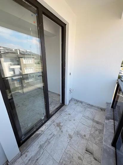 В Ortaca Bahçelievler 2+1 Закрытая Кухня С Бассейном Квартира На Продажу
